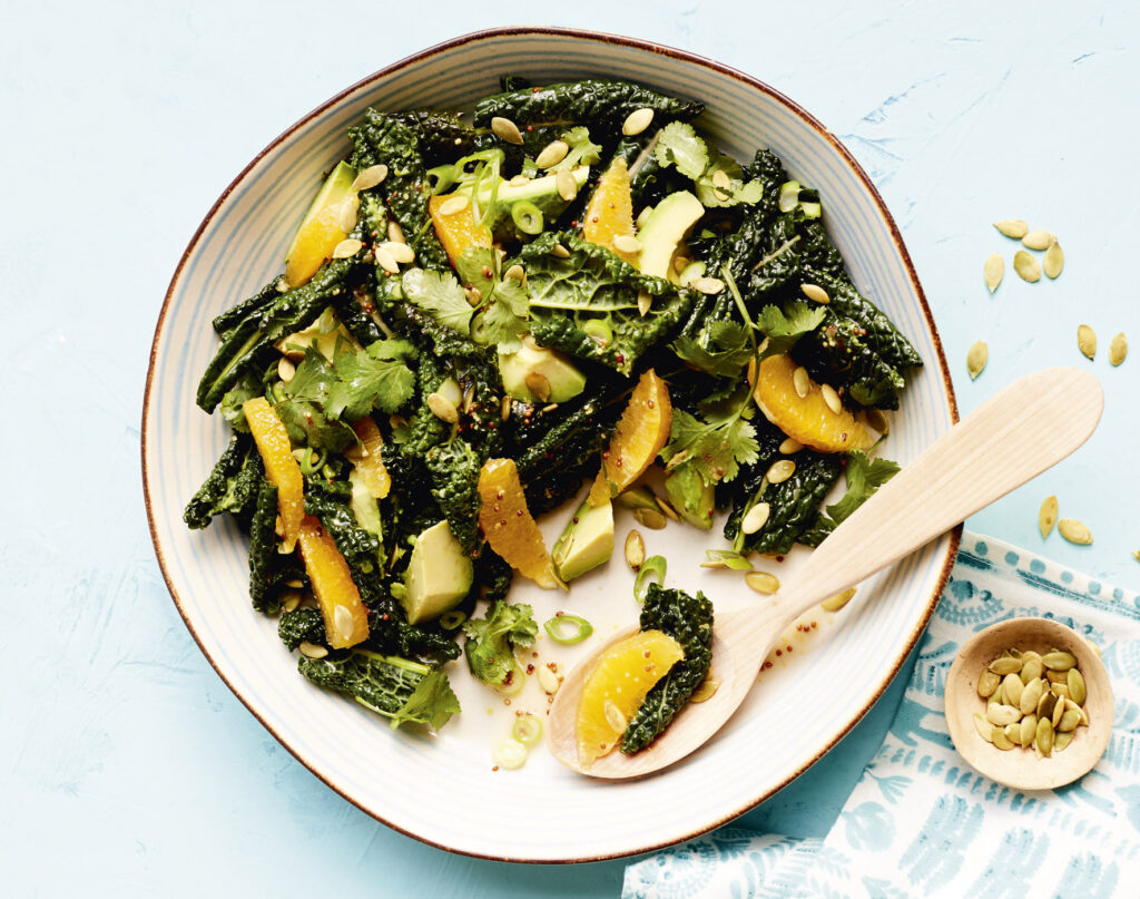 Overhead image of a Tuscan Kale, Orange & Avocado Salad.