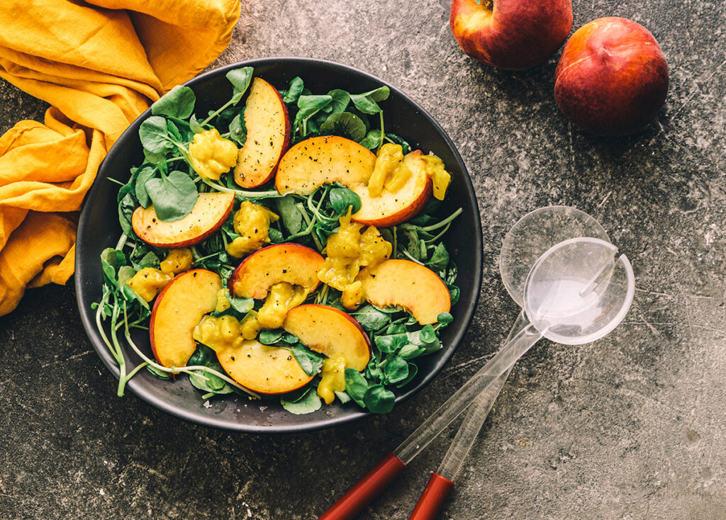 Colourful and delicious looking peach salad in a bowl