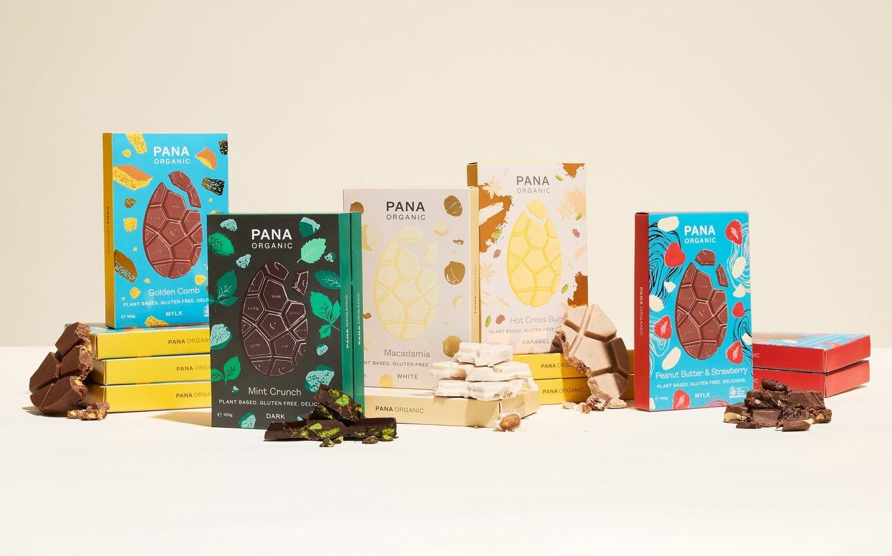 A selection of Pana Easter chocolates are displayed in abundance on a table with a cream coloured background. 