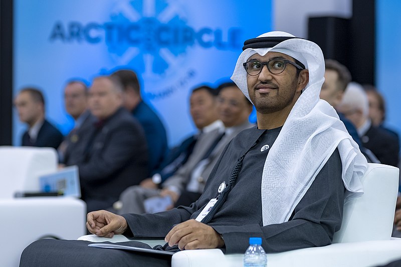 An image of Dr. Sultan Al Jaber seated at a conference.