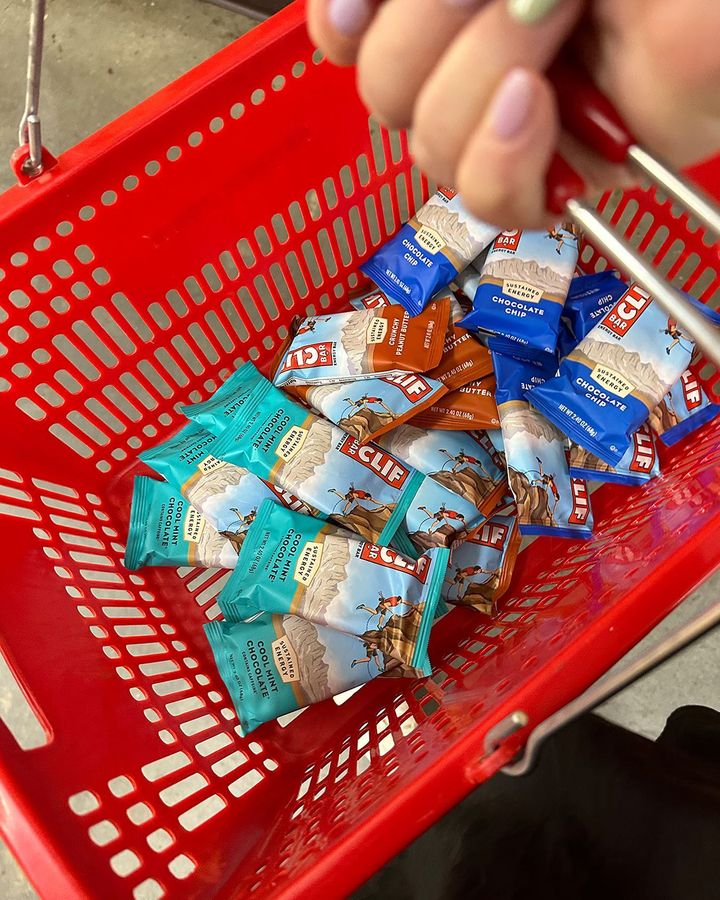 A bird's eye view of a shopping basket filled with Clif bars.