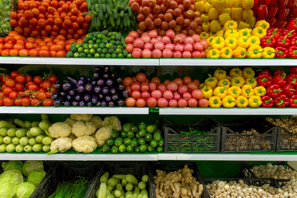 Fresh organic fruit and veg on shelf in supermarket. 