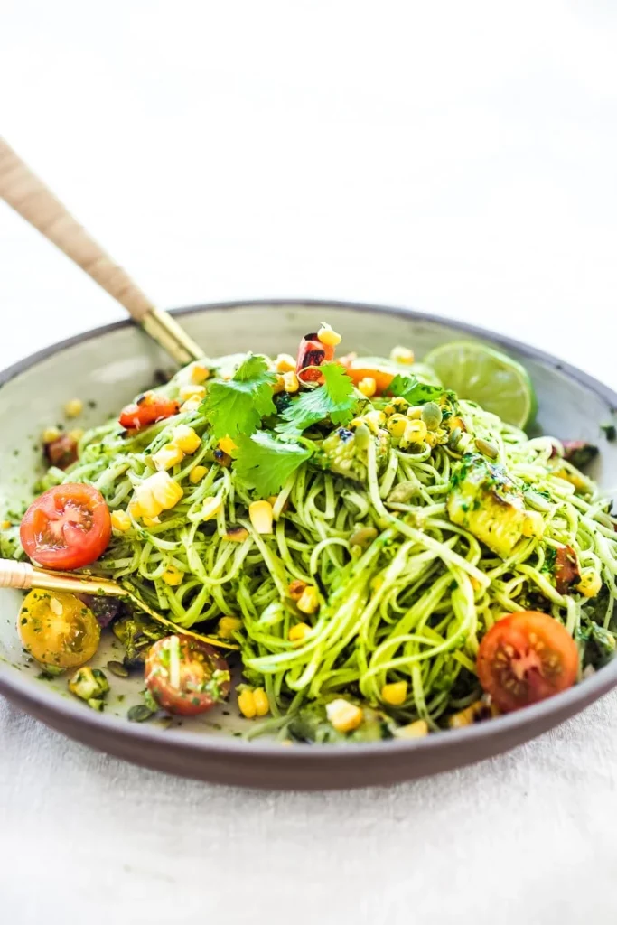 A refreshing-looking plate of green pasta salad.