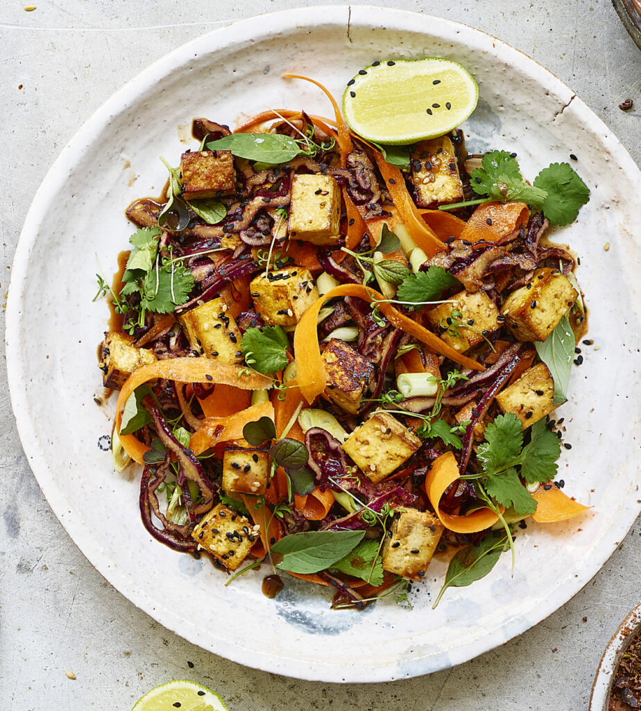 An overhead image of an appetizing Maple & Sesame Smoked Tofu Salad in a bowl.