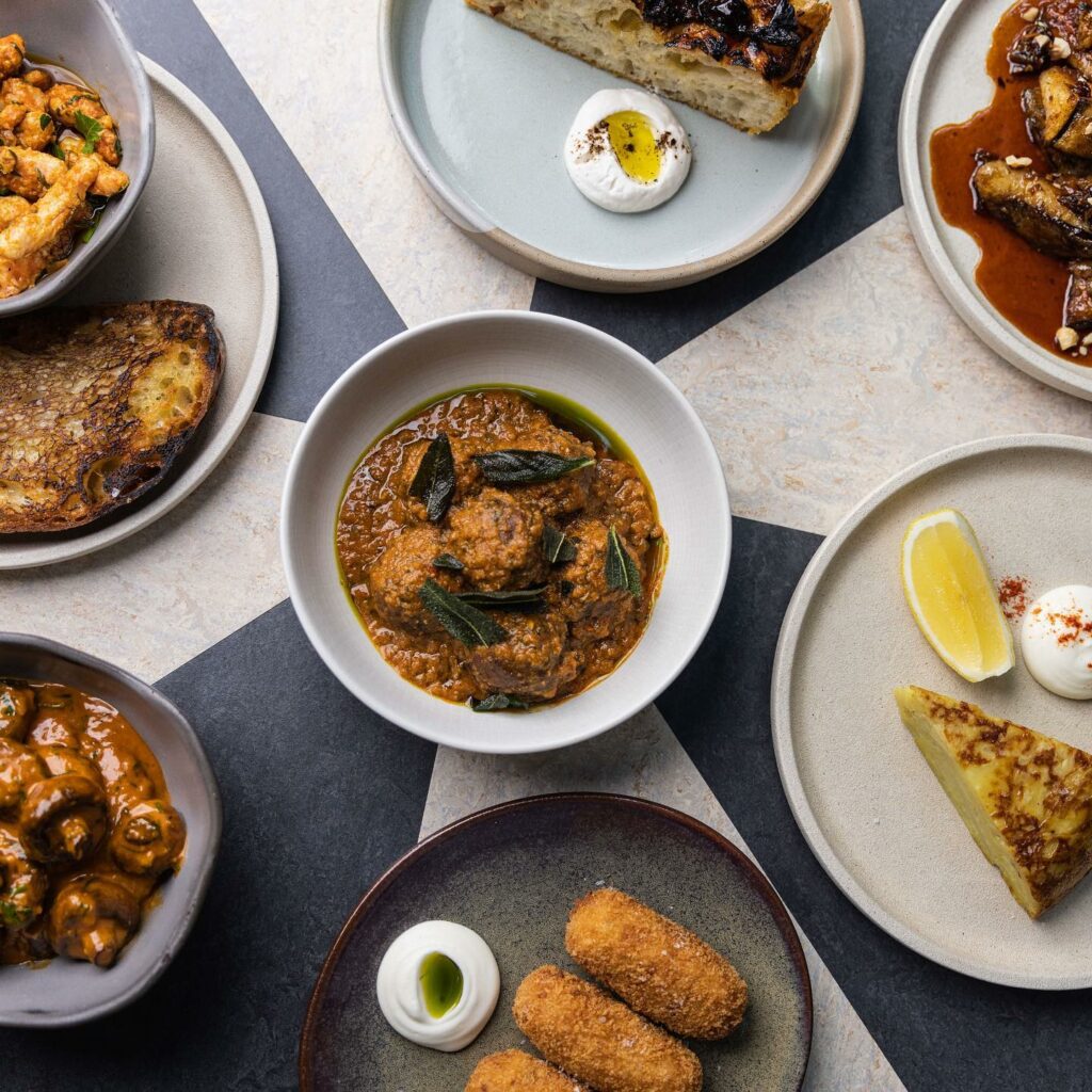 A selection of tasting dishes are shown from overhead. 