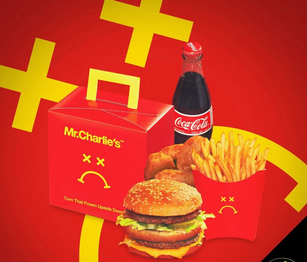 A promo picture on a red background of a 'Frownie Meal', featuring a burger, fries, nuggets and a coke.