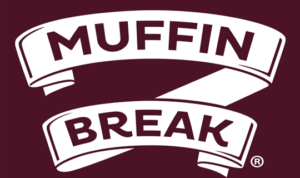 Muffin break logo in white on a dark maroon background.