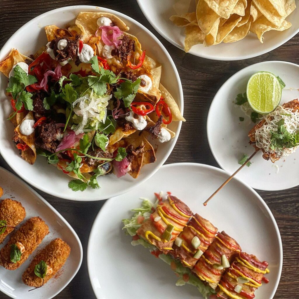 Overhead shot of various Mexican dishes on a table.