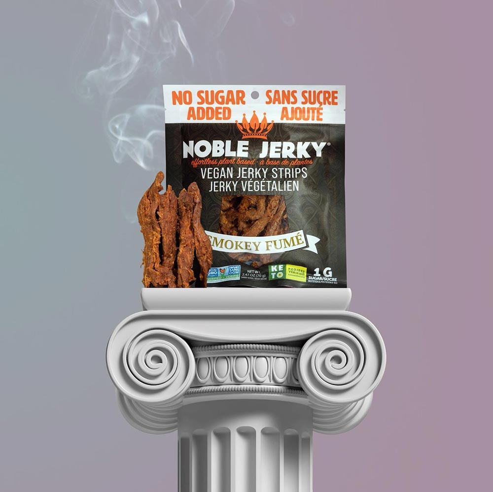 A packet of Noble plant-based jerky sits atop a plinth.