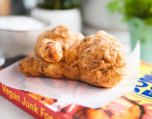 A side profile of two vegan 'chicken' drumsticks'.