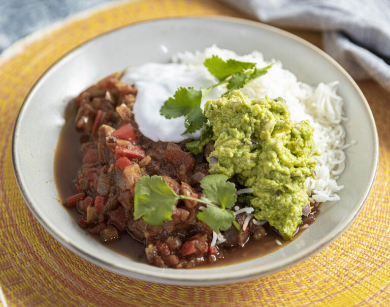 smoked chilli in a bowl with smashed avocado