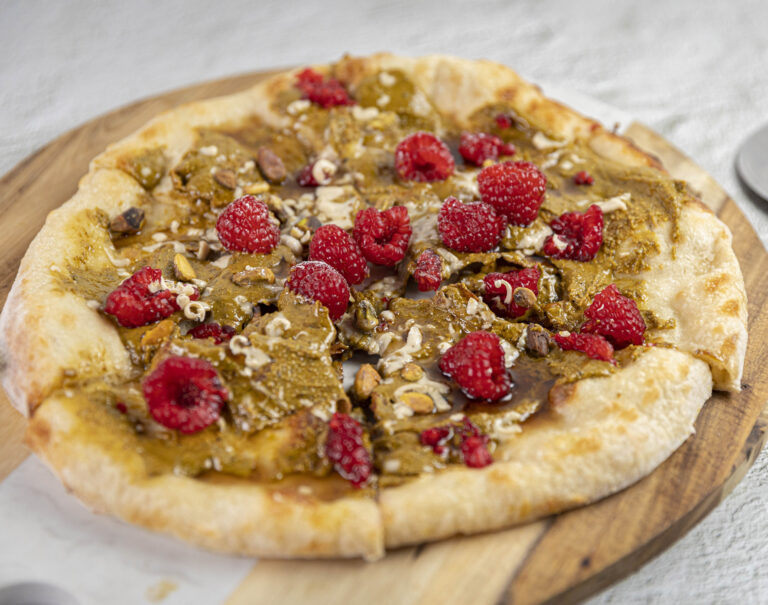 yummy looking vegan pizza with white chocolate and red berries