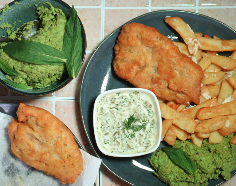 Overhead image of battered 'fish' and chips with tartare sauce.