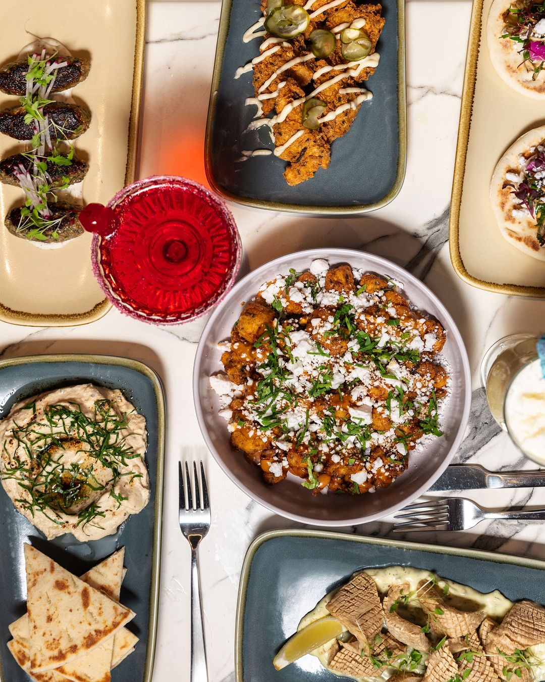 Overhead image of a range of dishes and drinks.