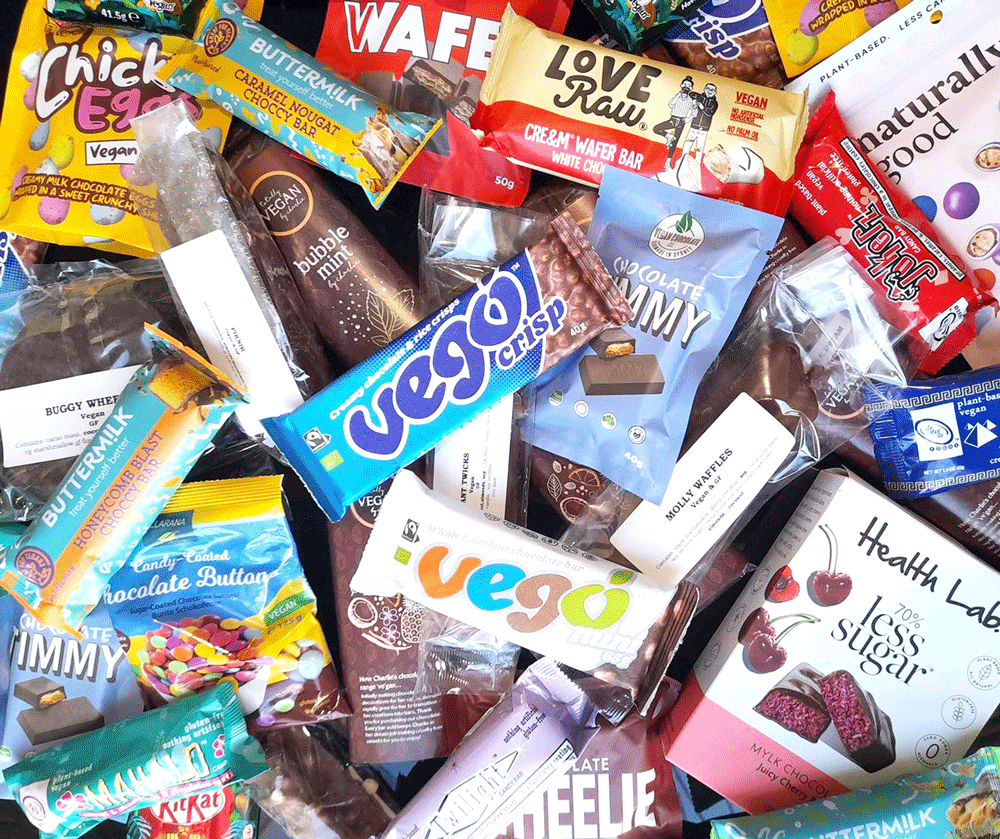 Overhead shot of a wide range of vegan chocolate bars.